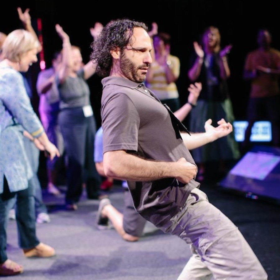 Steven playing air guitar with Brené Brown