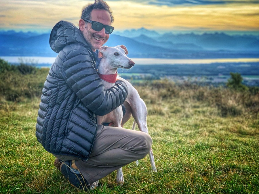A dog sit by Lake Geneva