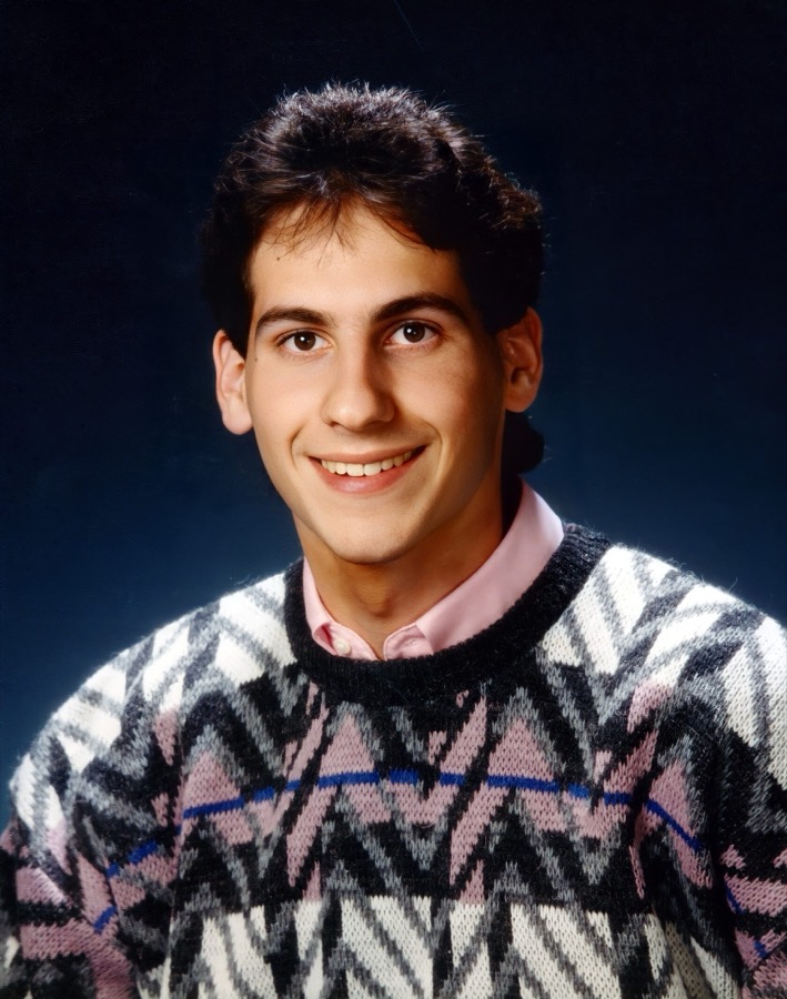Steven's high school portrait in a patterned sweater